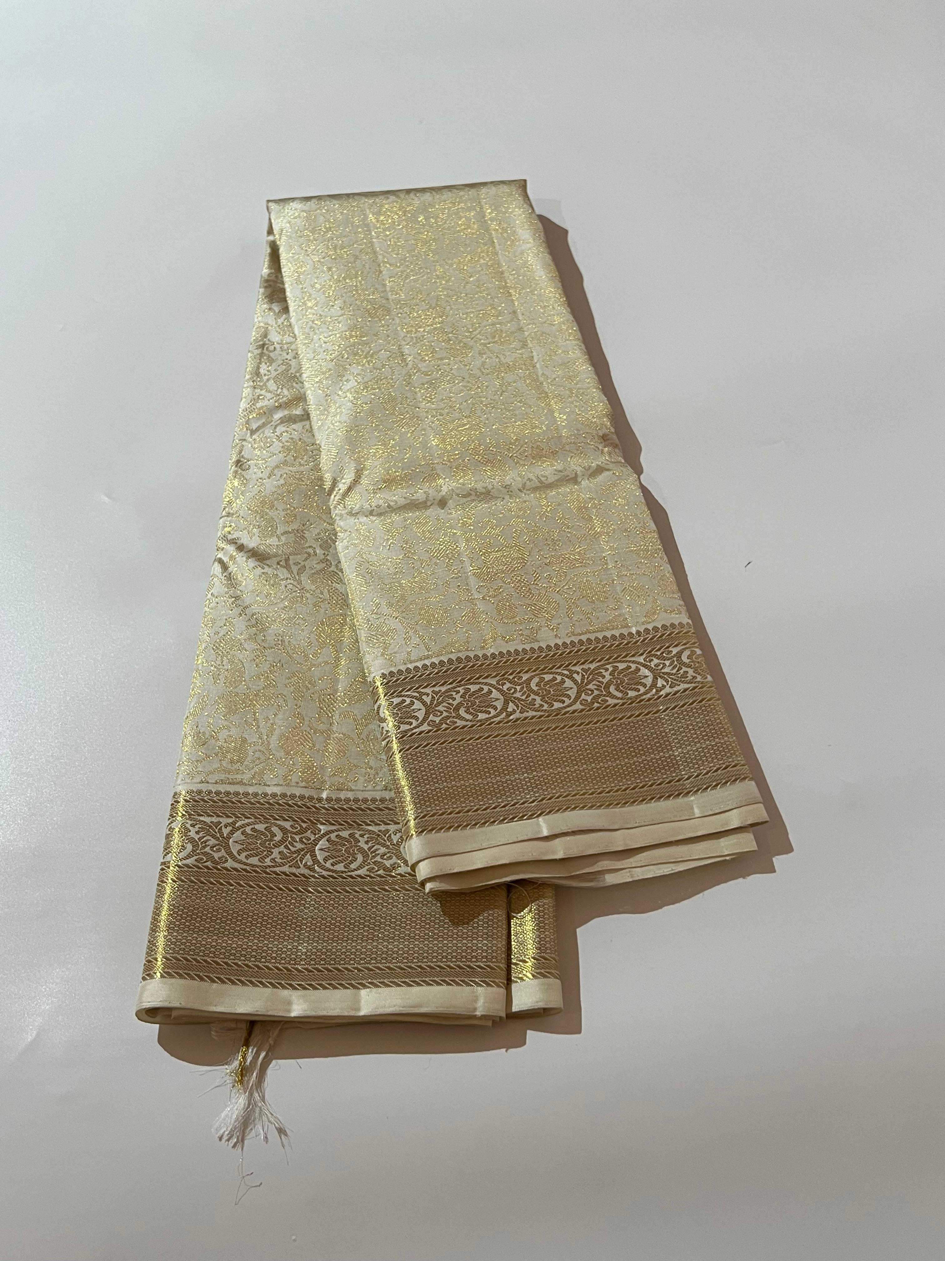 White and golden Kanjeevaram silk saree