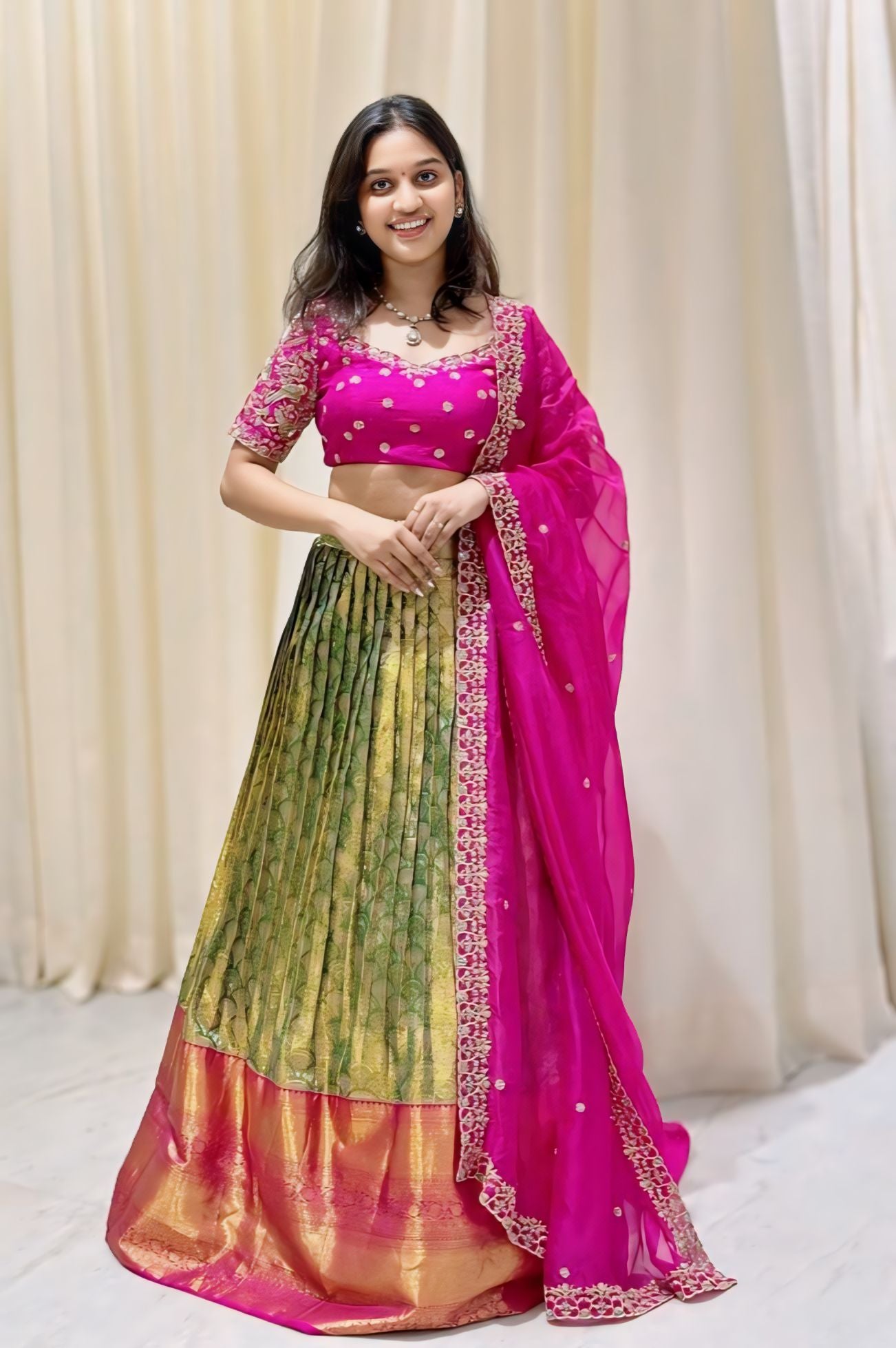 Verdurous Pink and Green Pattu lehenga set