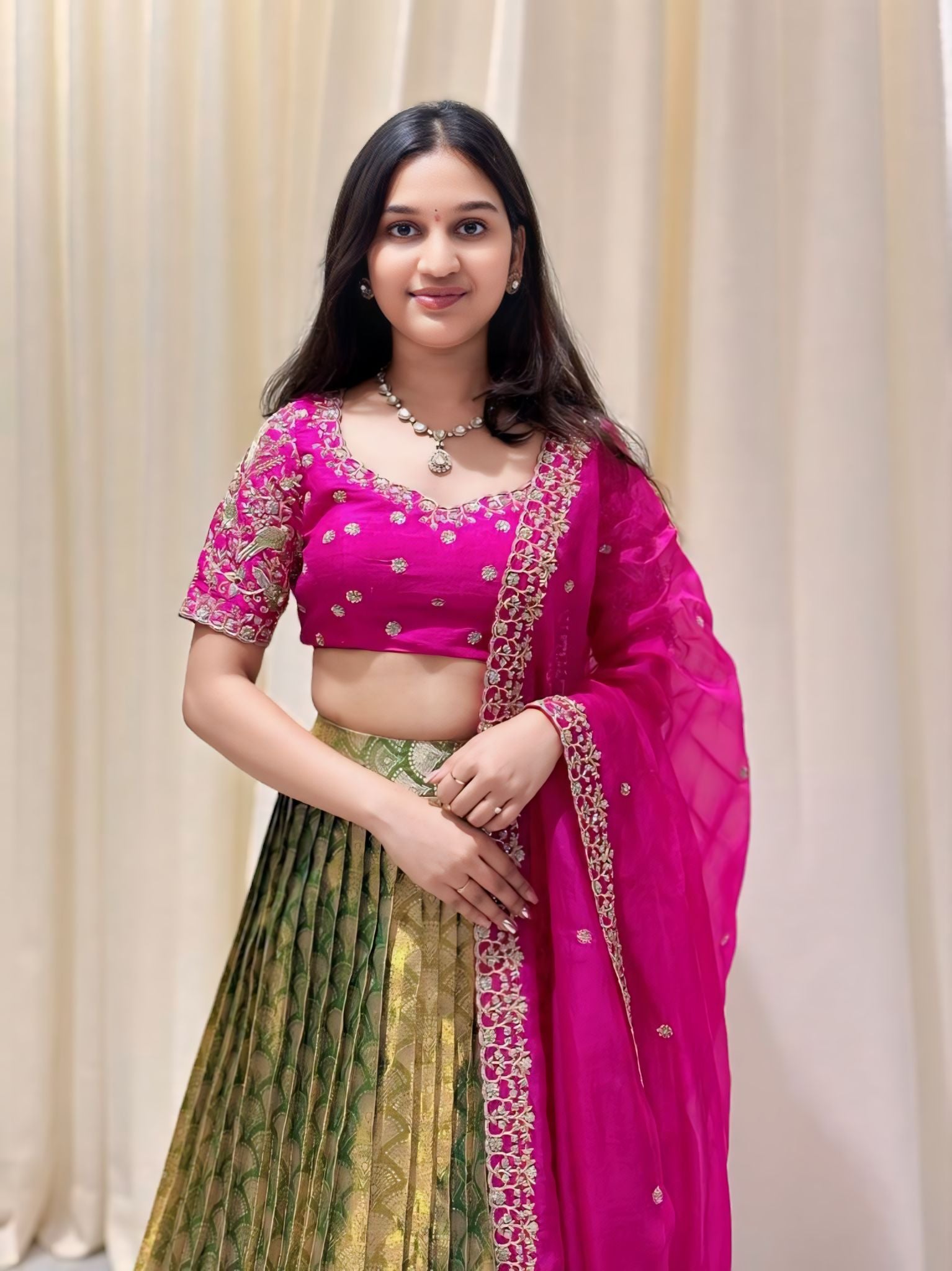 Verdurous Pink and Green Pattu lehenga set