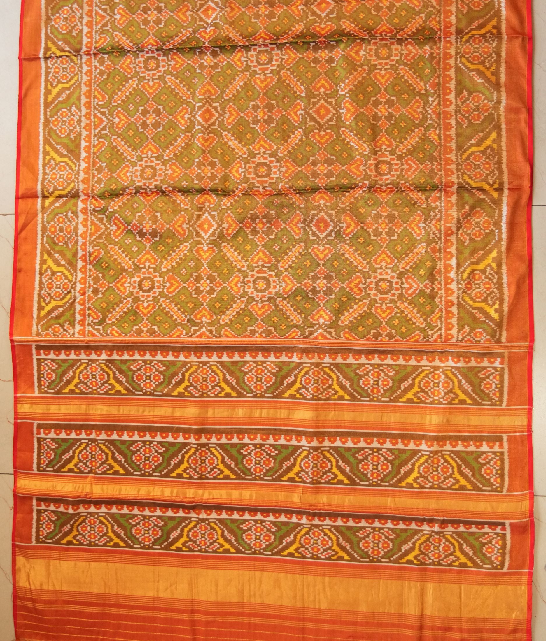 Mandakini Dark Green Tissue Patola Saree