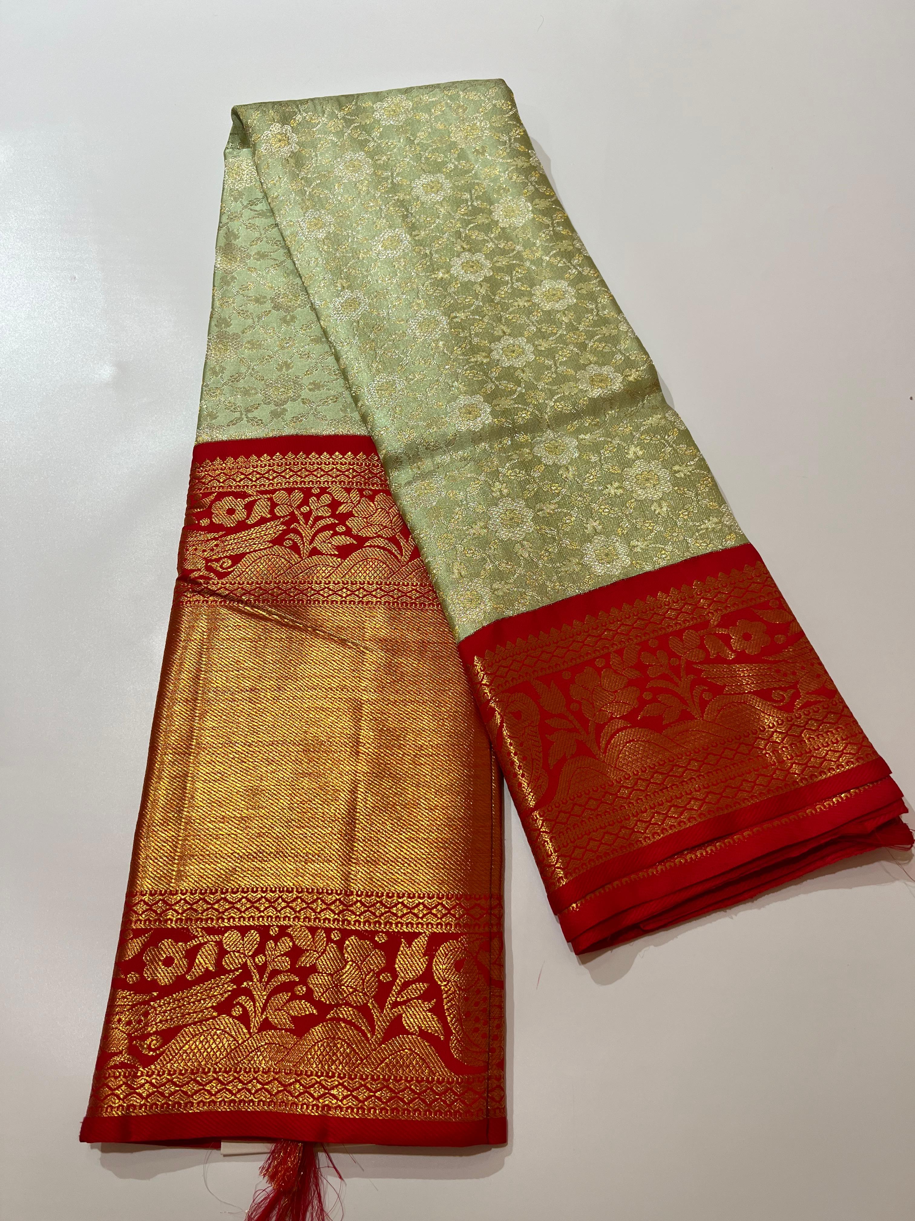 Light green and gorgeous red Kanjeevaram silk saree